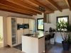 Chalet Pressegger See modern kitchen with cooking island, oven, steam oven, 2 fridges, freezer, induction hob and dishwasher